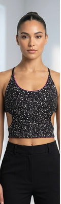 Front view of reversible UV-reactive black festival top